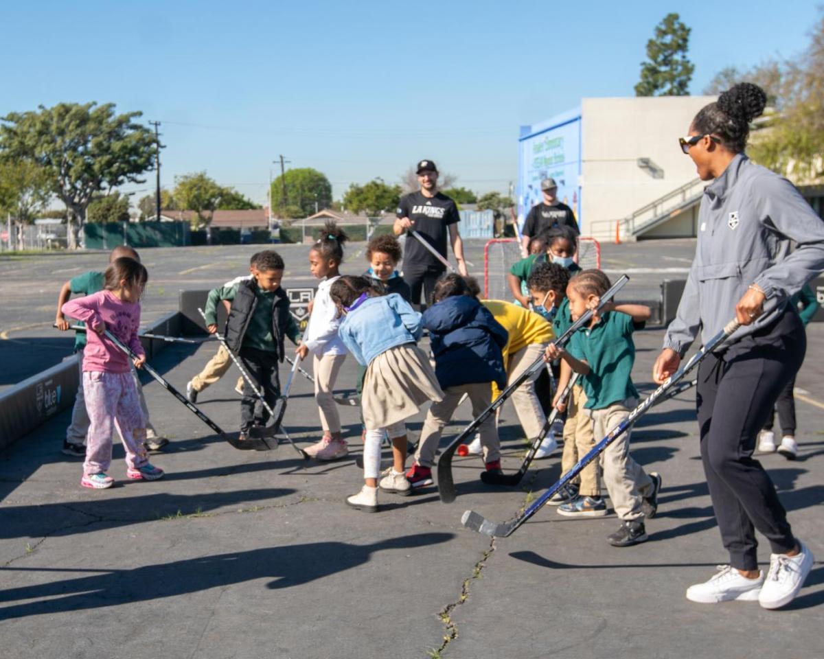 LA Kings Hockey Development Team hosts a ball hockey clinic for the students.
