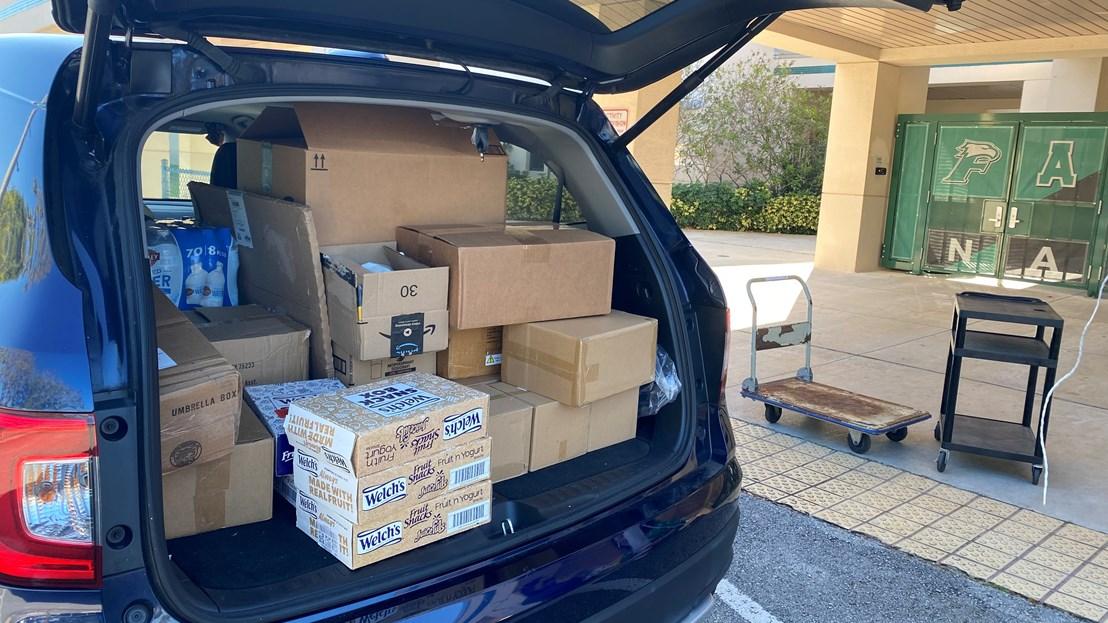 Aflac PLADS car shown filled with supplies for the closet.