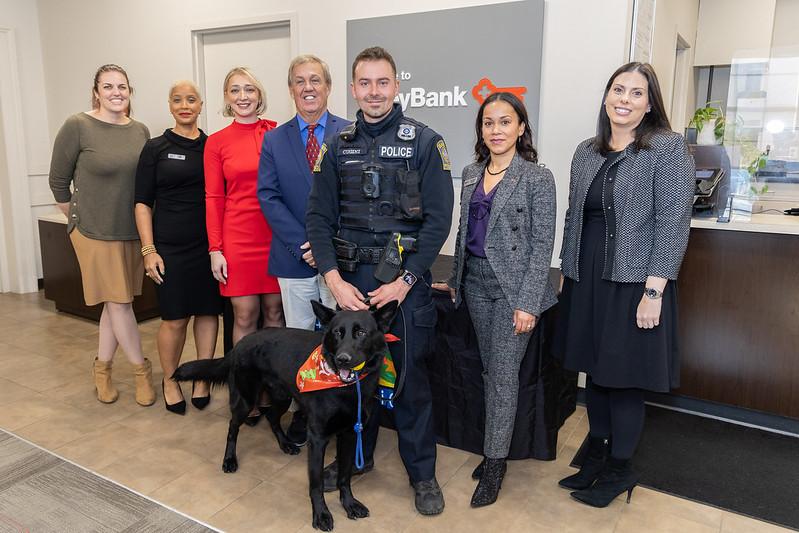 Police officer shown with K-9 Jet and representatives from KeyBank and The Hometown Foundation.