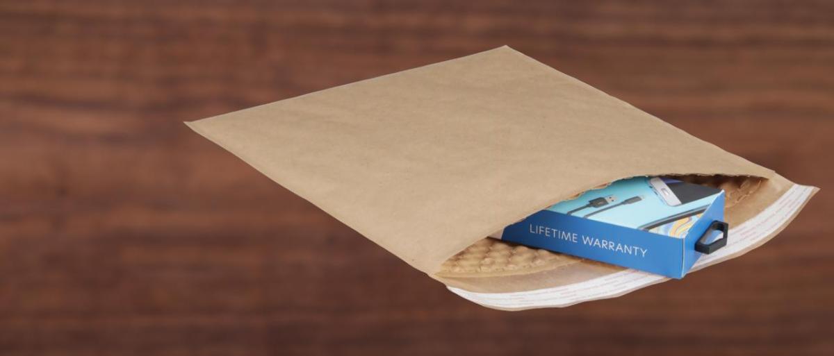 Brown paper mailing envelope with small product inside
