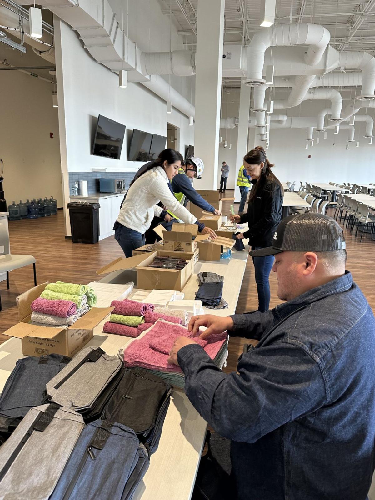 volunteer packing zippered bags with washcloths
