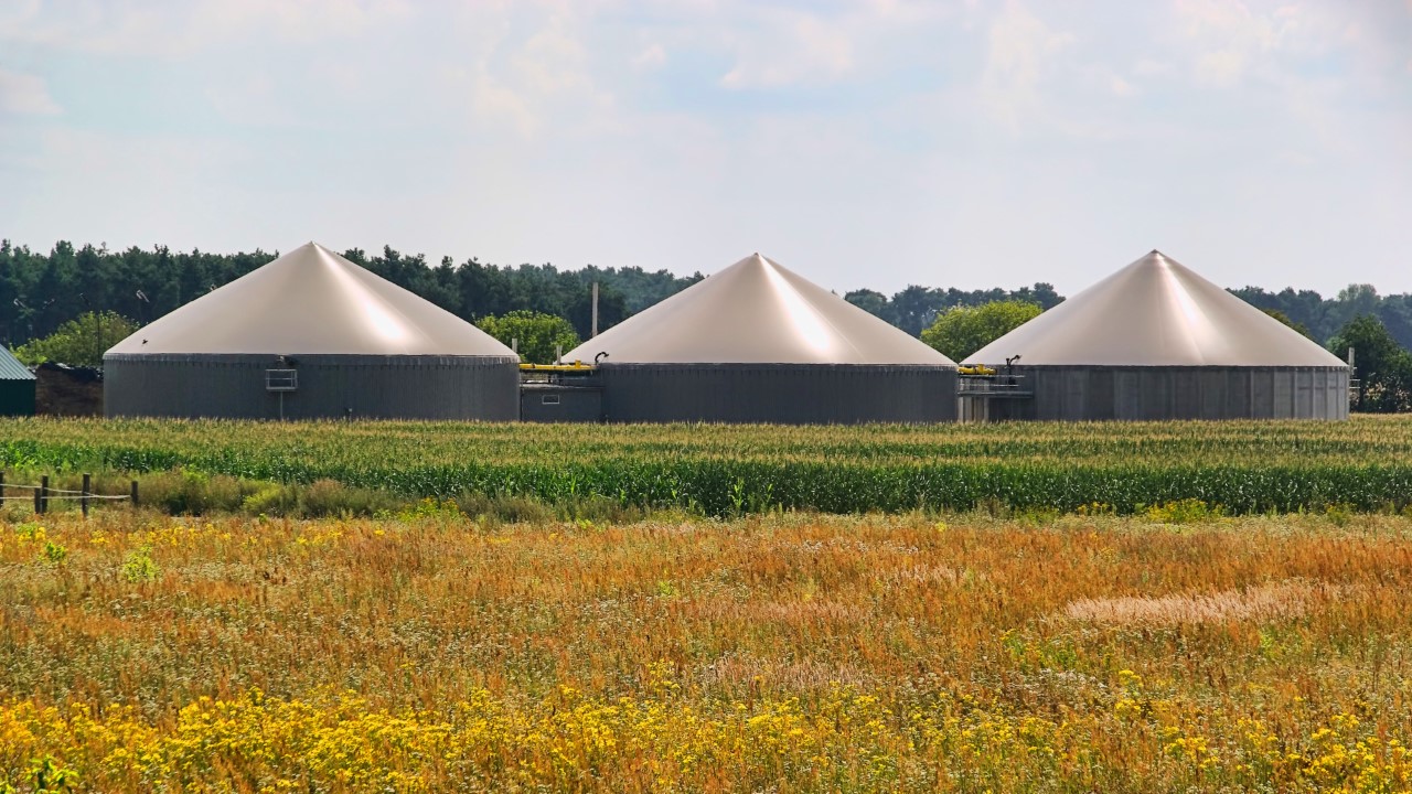 3 silos in a field