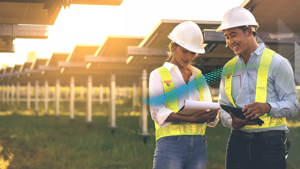 Two people stood onsite at a solar farm