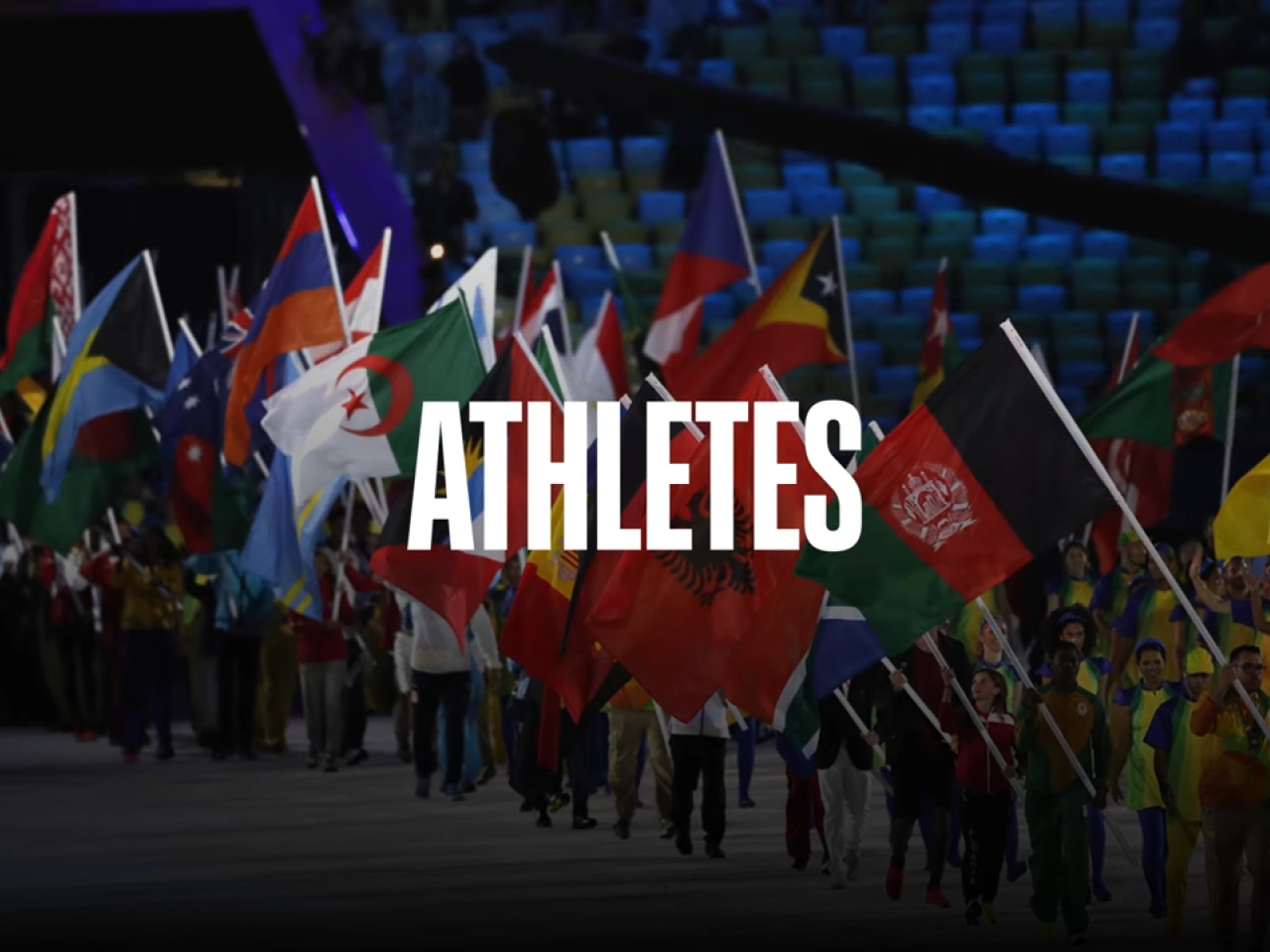 People carrying world flags with the text 'Athletes' layered on top of the image