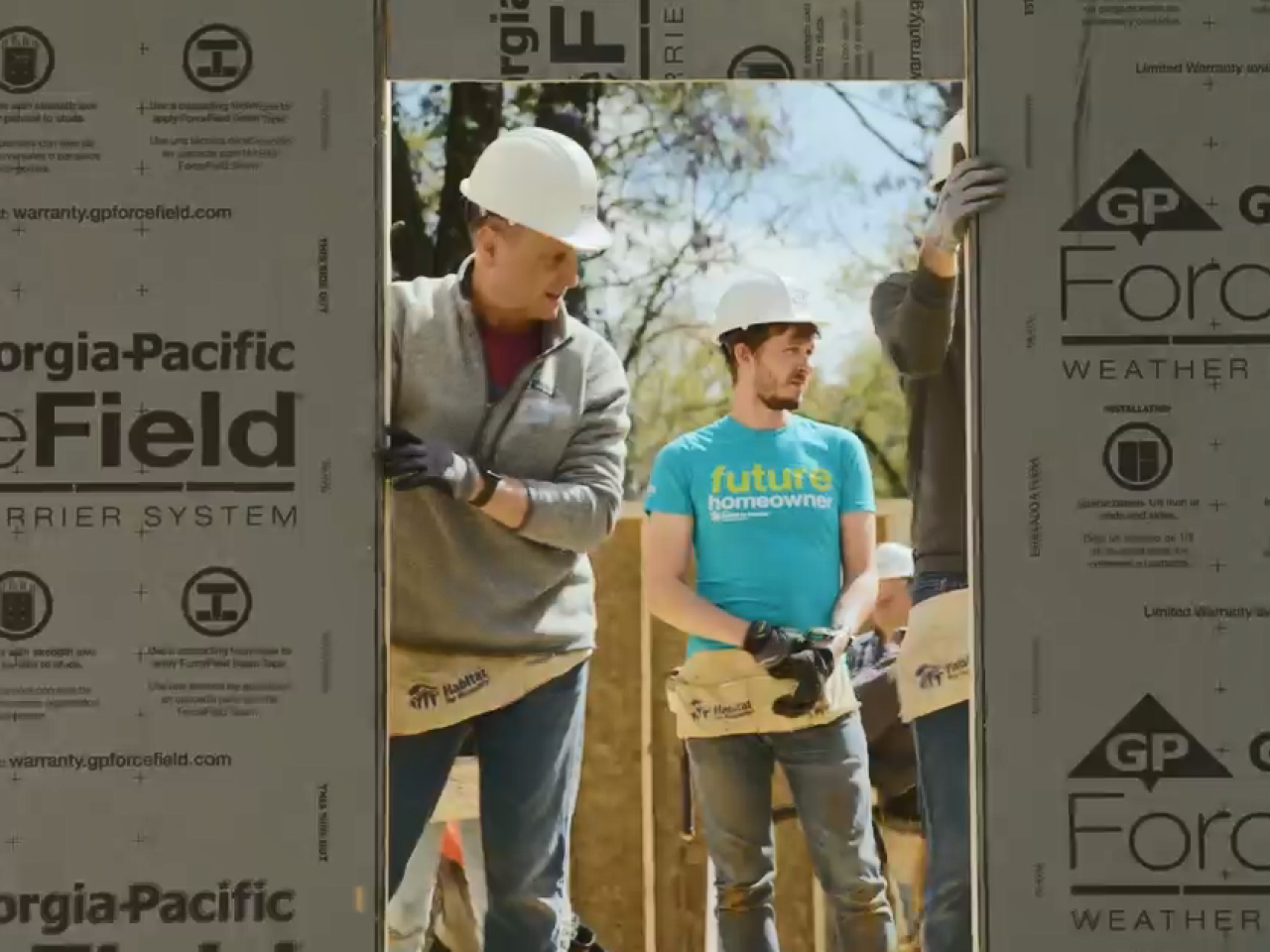 People building a home.