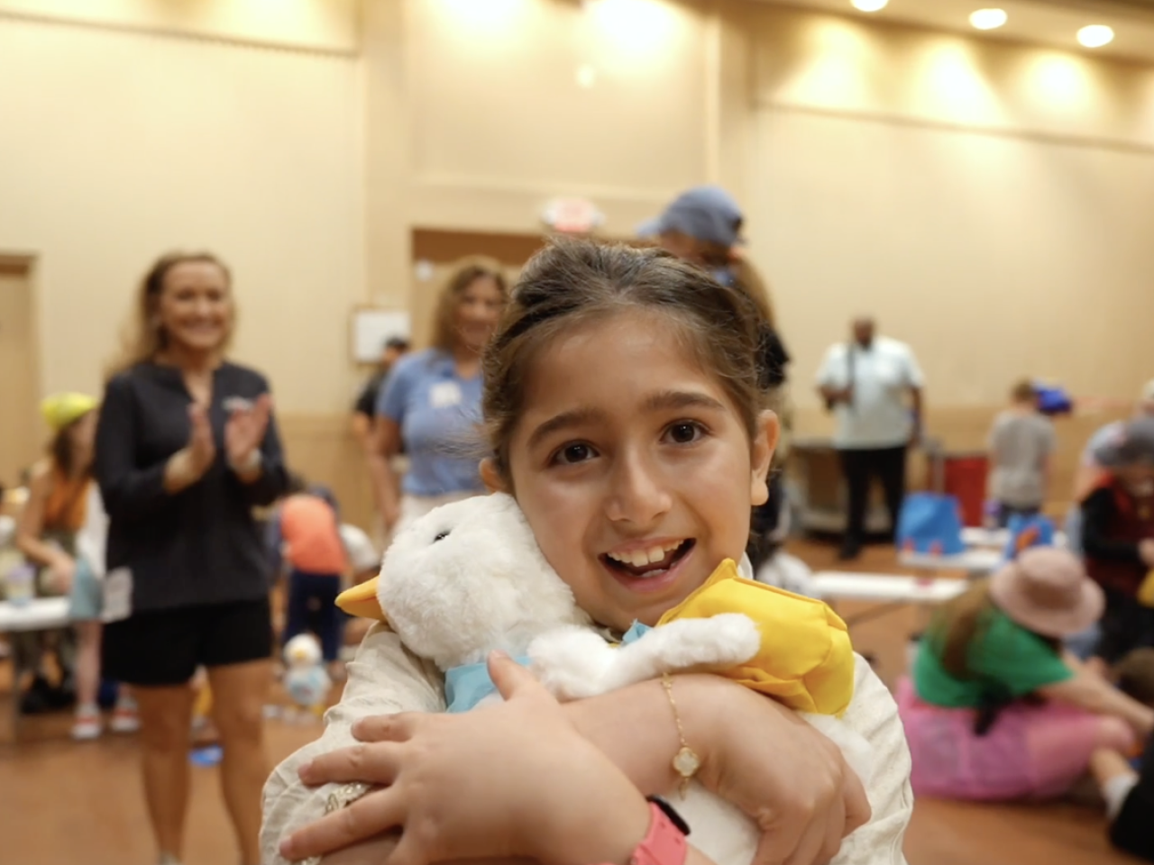 Young girl shown holding her Aflac Duck.