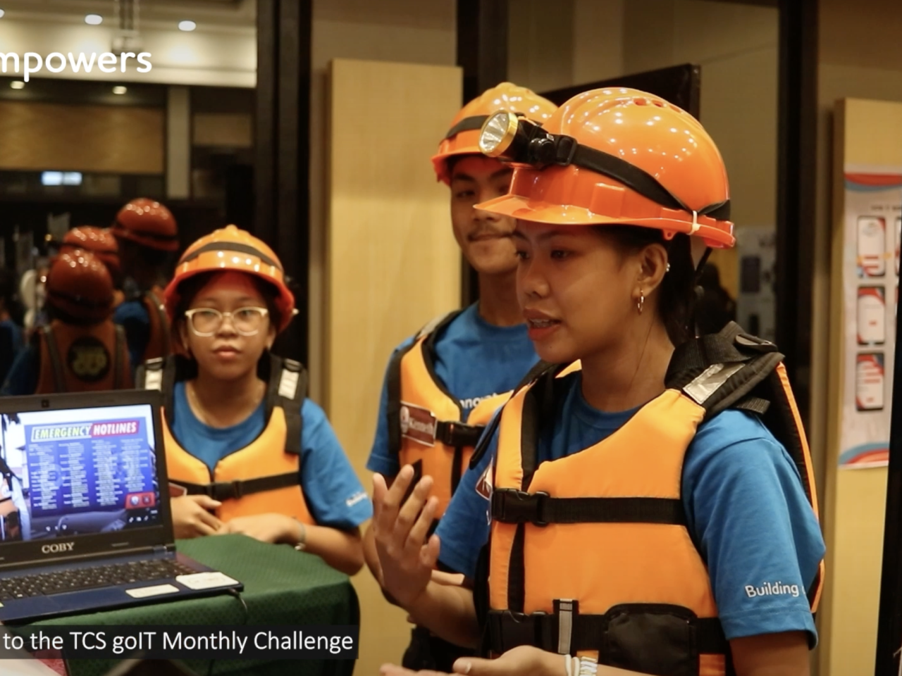 Instructor teaching students wearing safety gear