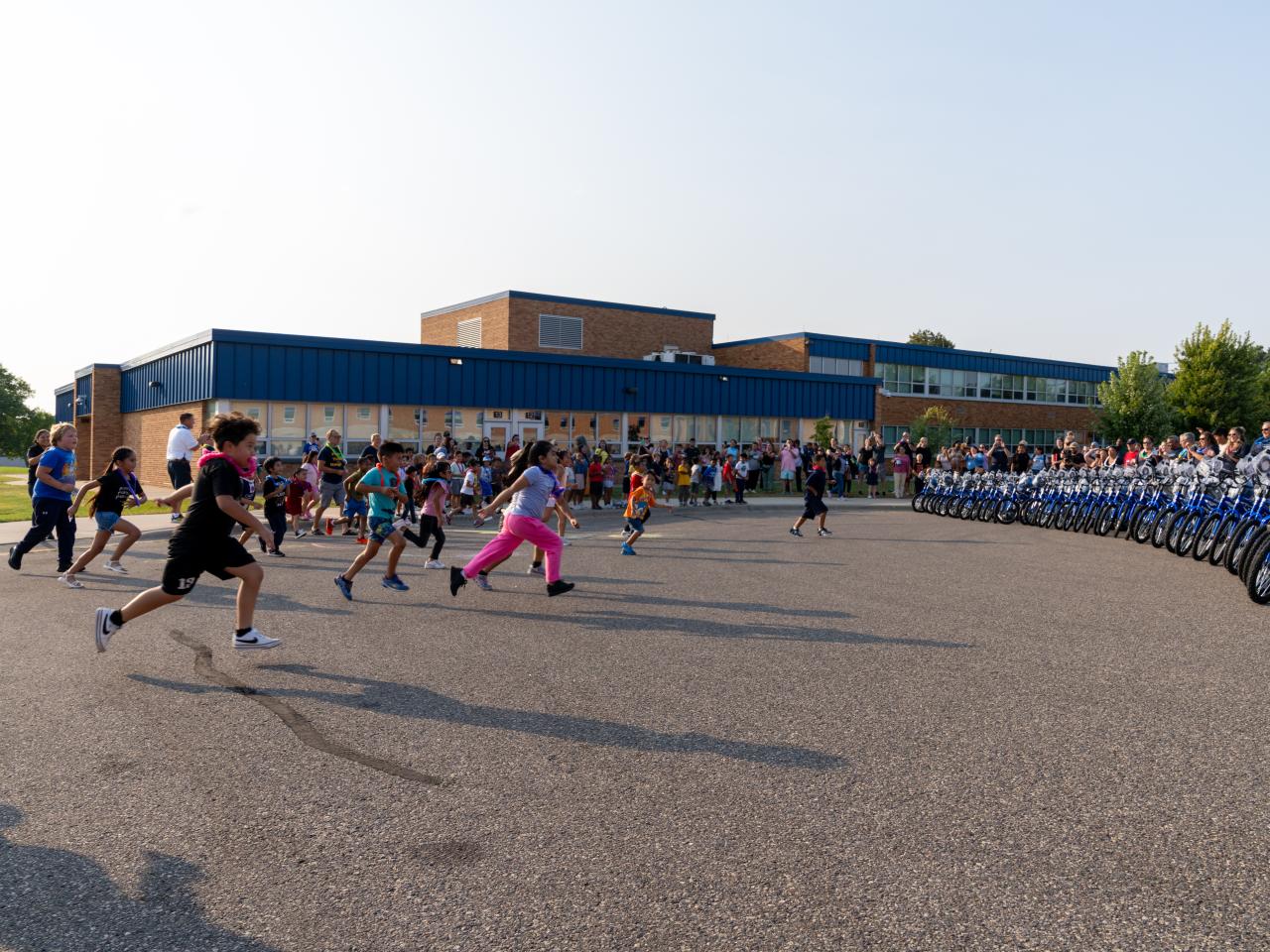 Students surprised and running to new bikes