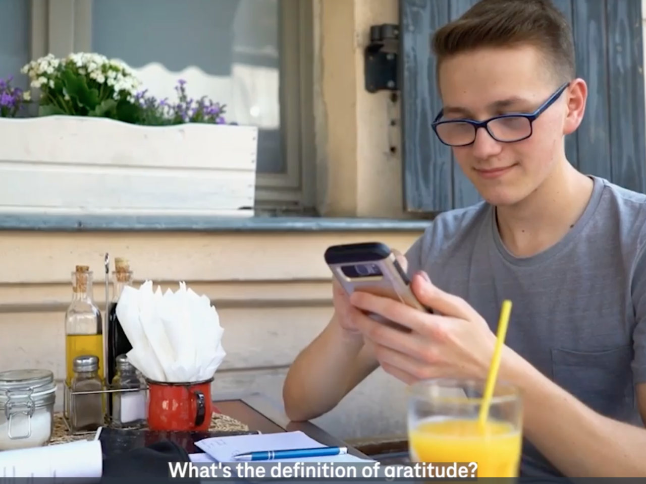 Person on phone at breakfast