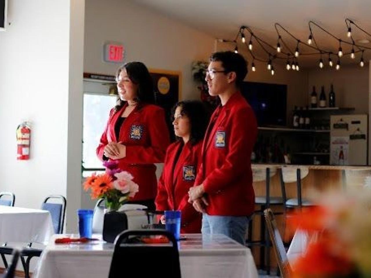 A group of people standing in a room