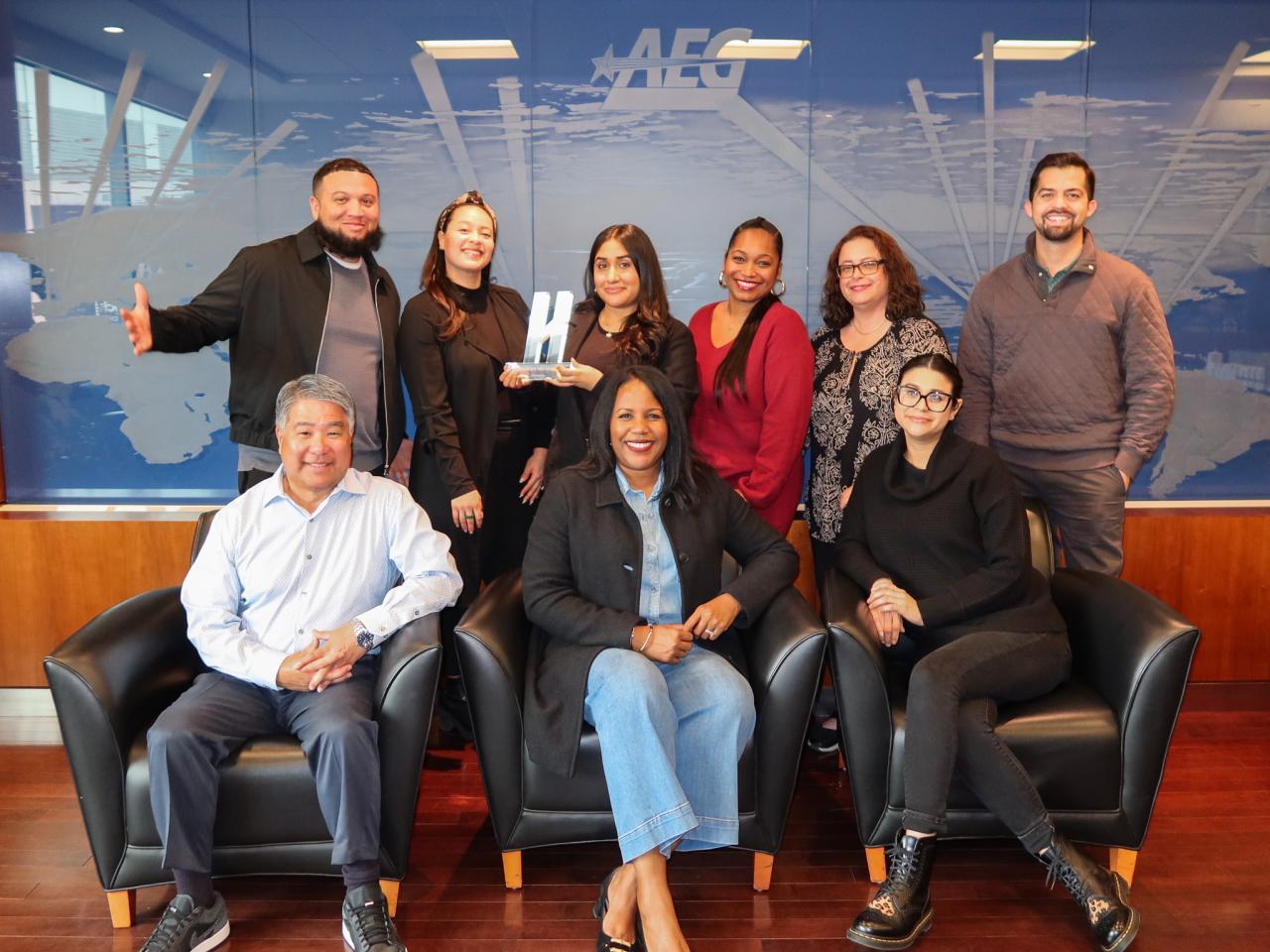 AEG's Talent Acquisition Team posed with Handshake's Early Talent Award. 