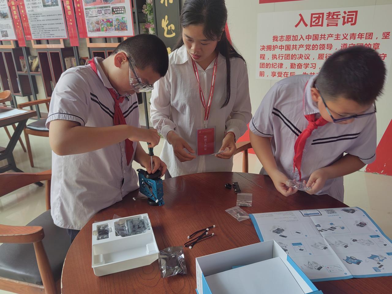Chinese STEM students work with teacher