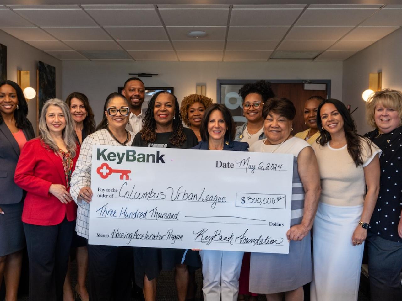 The Columbus Urban League and KeyBank representatives shown with a $300,000 grant check.