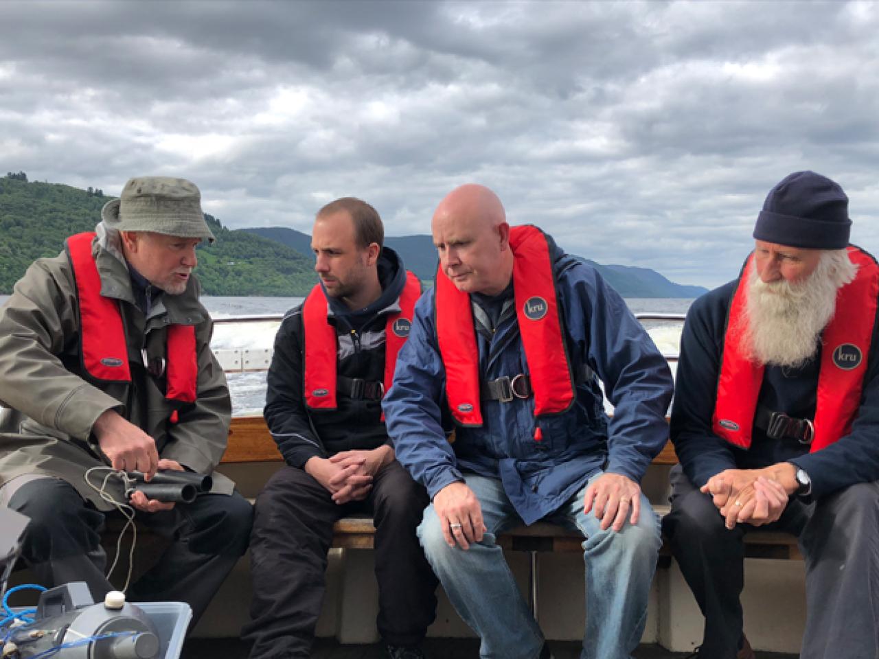 Eric Verspoor, Gert-Jan Jeunen, Neil Gemmell, and Adrian Shine aboard the boat Deepscan on Loch Ness. | Photo by Neil Gemmell