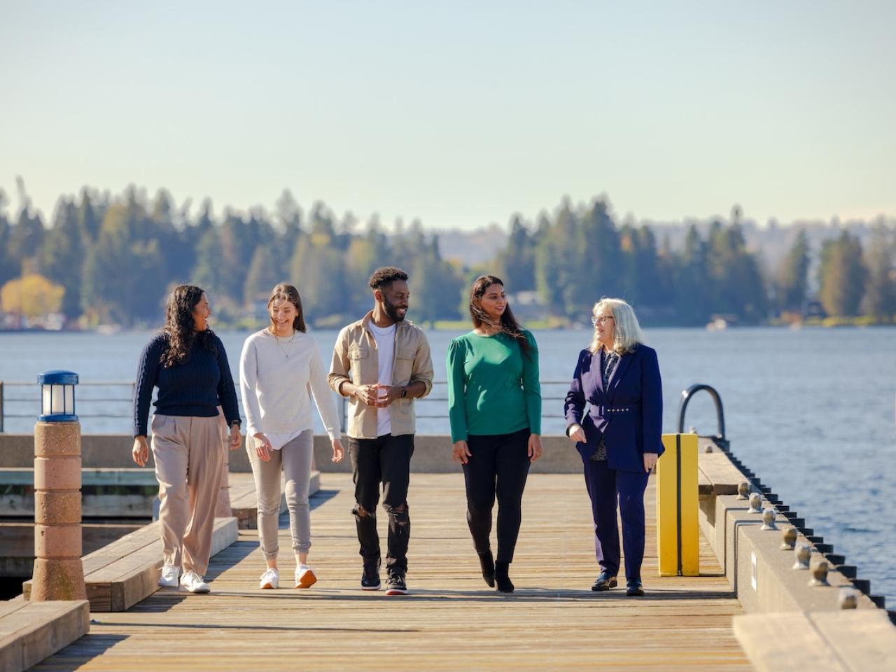 Group of GoDaddy employees walking along a pier.