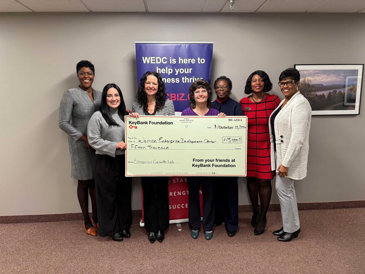 Leaders from WEDC and KeyBank gather for a check presentation.  Pictured from left: KeyBank Poughkeepsie Branch Manager Nwan Marc; WEDC Spanish Program Manager, Brianna Trujillo; WEDC CEO Nikki A. Hahn; WEDC Mid-Hudson Women’s Business Center Director Cynthia Marsh-Croll; WEDC Business Counselor Maureen Brivett; KeyBank Senior Area Retail Leader, Irenee Provenzano; and KeyBank Personal Banker Migdalia Pellot. 