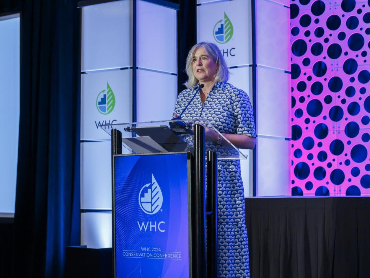Margaret O'Gorman speaking onstage at the 2024 WHC Conservation Conference