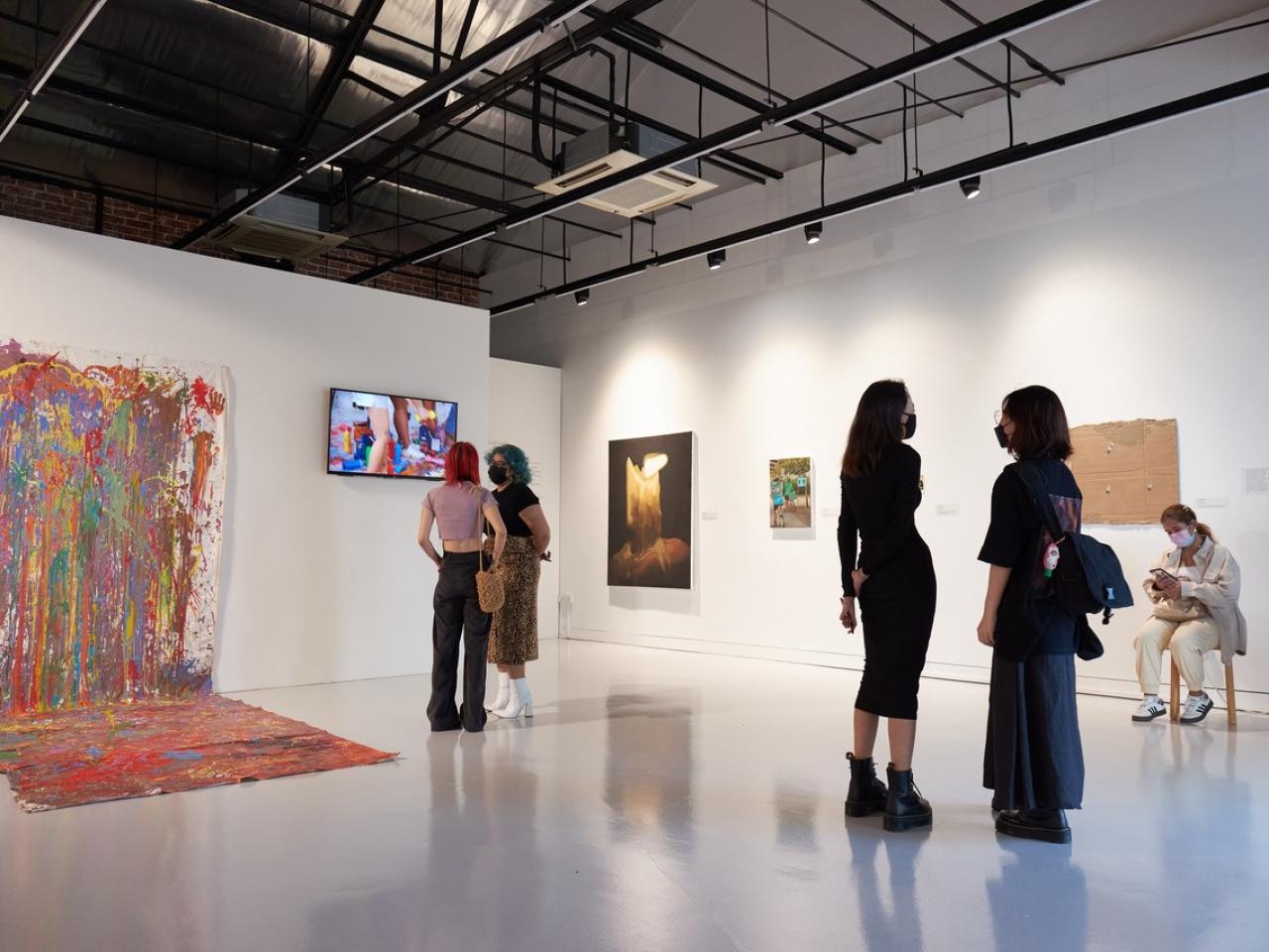 an art gallery with attendees