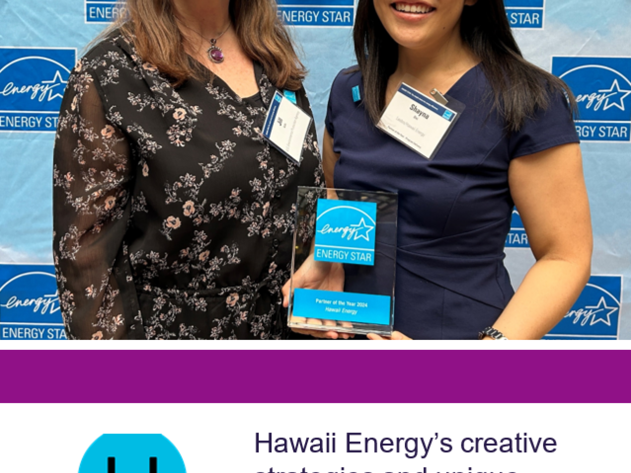 Two people posed holding an award. "Hawai'i Energy" logo at the bottom.