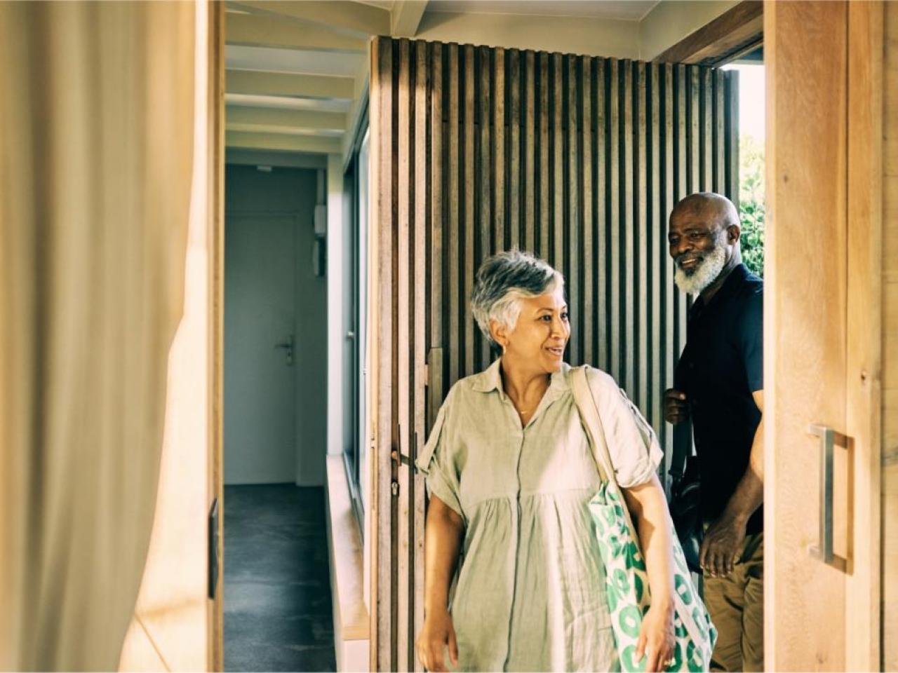 Two people entering a building 