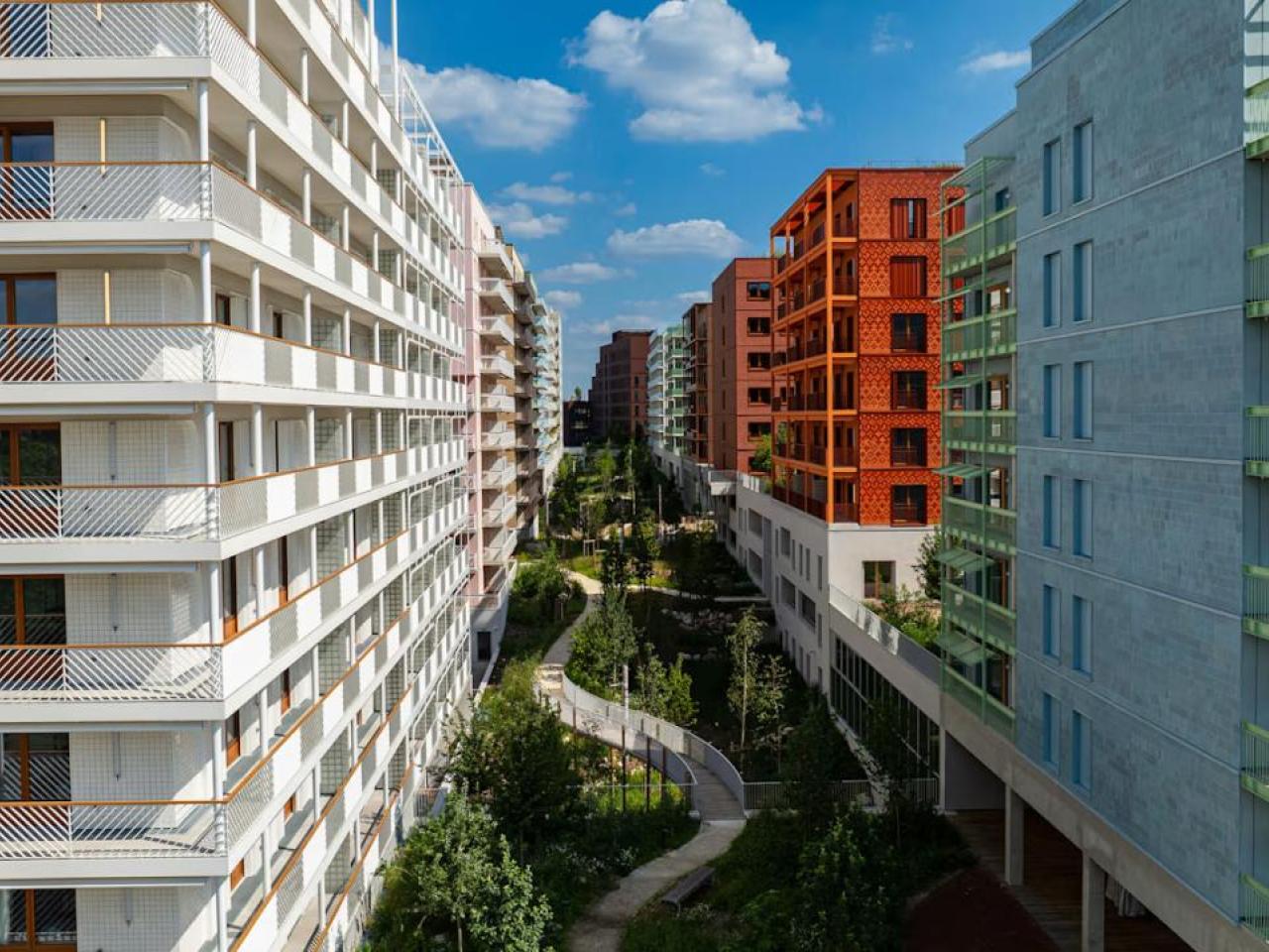 Aerial view of a courtyard between tall residential complexes.