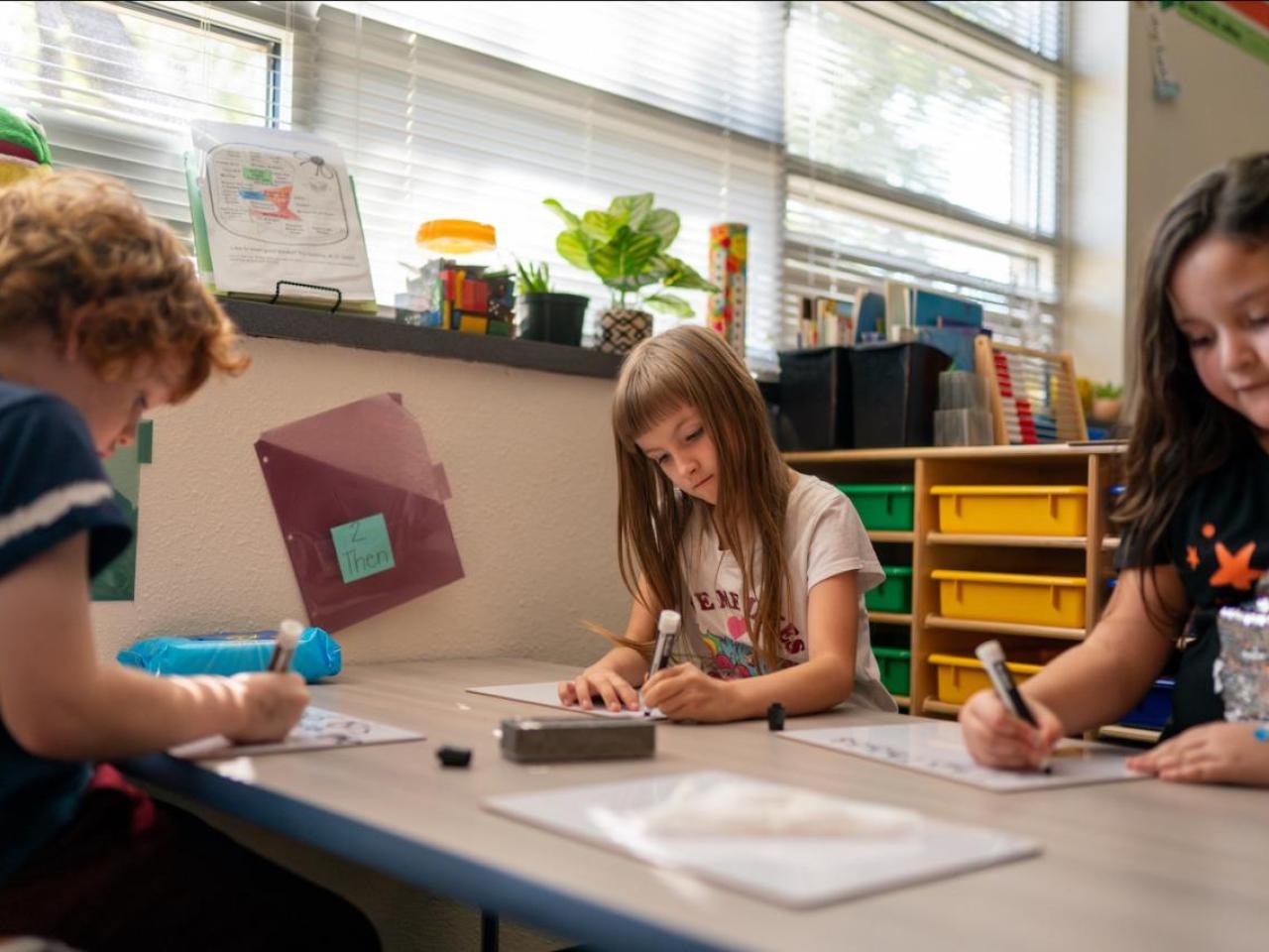 children learning in a classroom