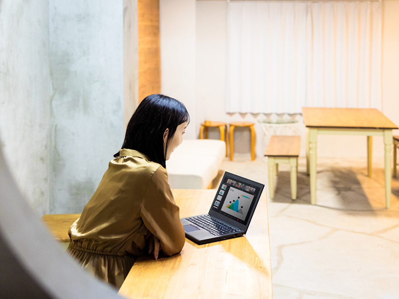 Woman looking at a laptop computer.