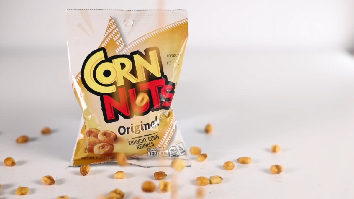 Small bag of Corn Nuts and kernels falling down.