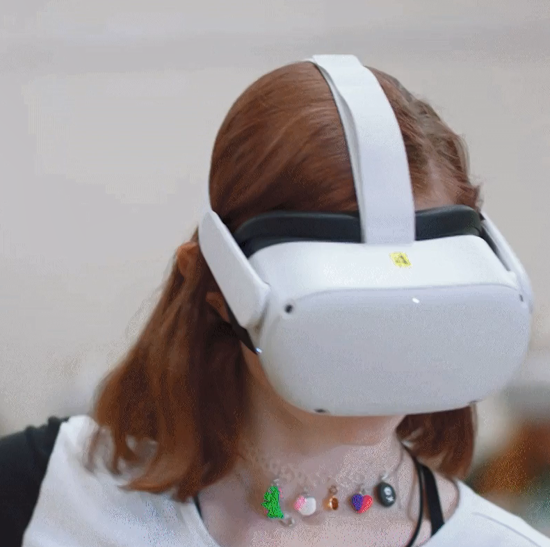 A person using a VR headset and controller