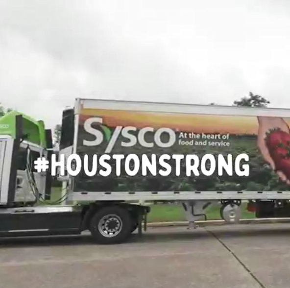 "#houstonstrong" over the image of a semi-truck with Sysco logo.