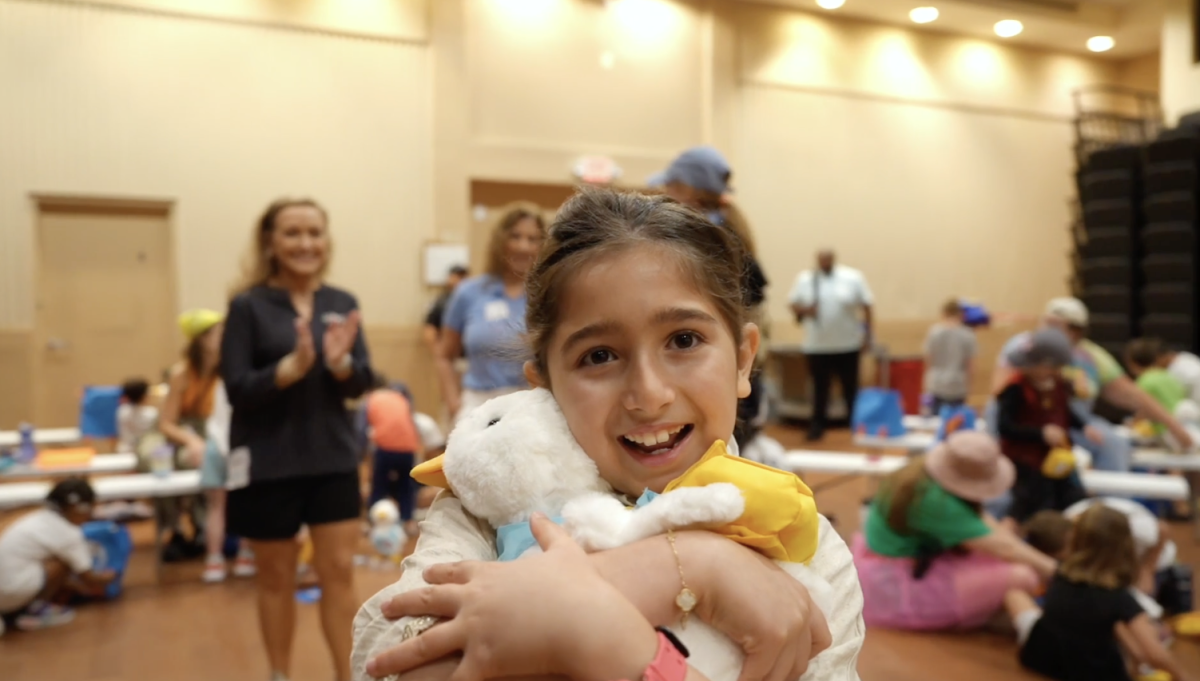 Young girl shown holding her Aflac Duck.