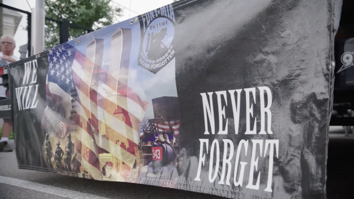 A banner with the text "never forget" 