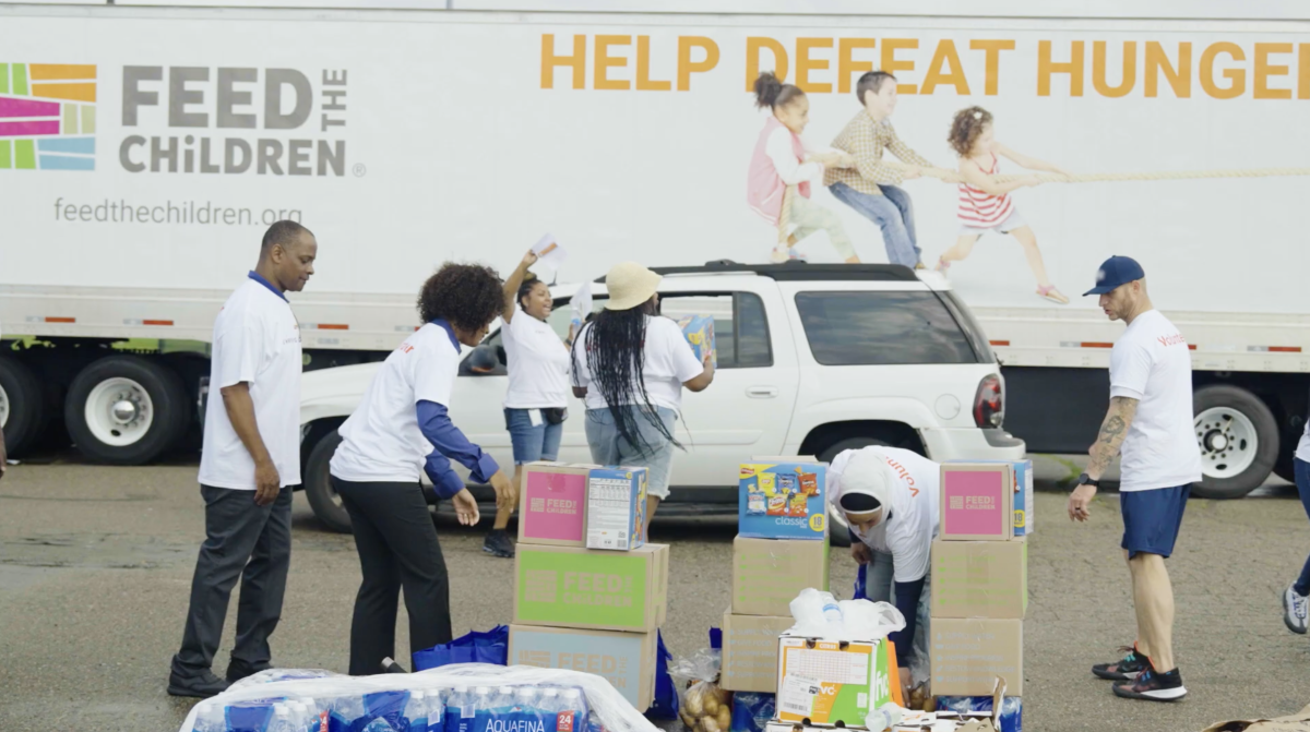 Volunteers stack boxes