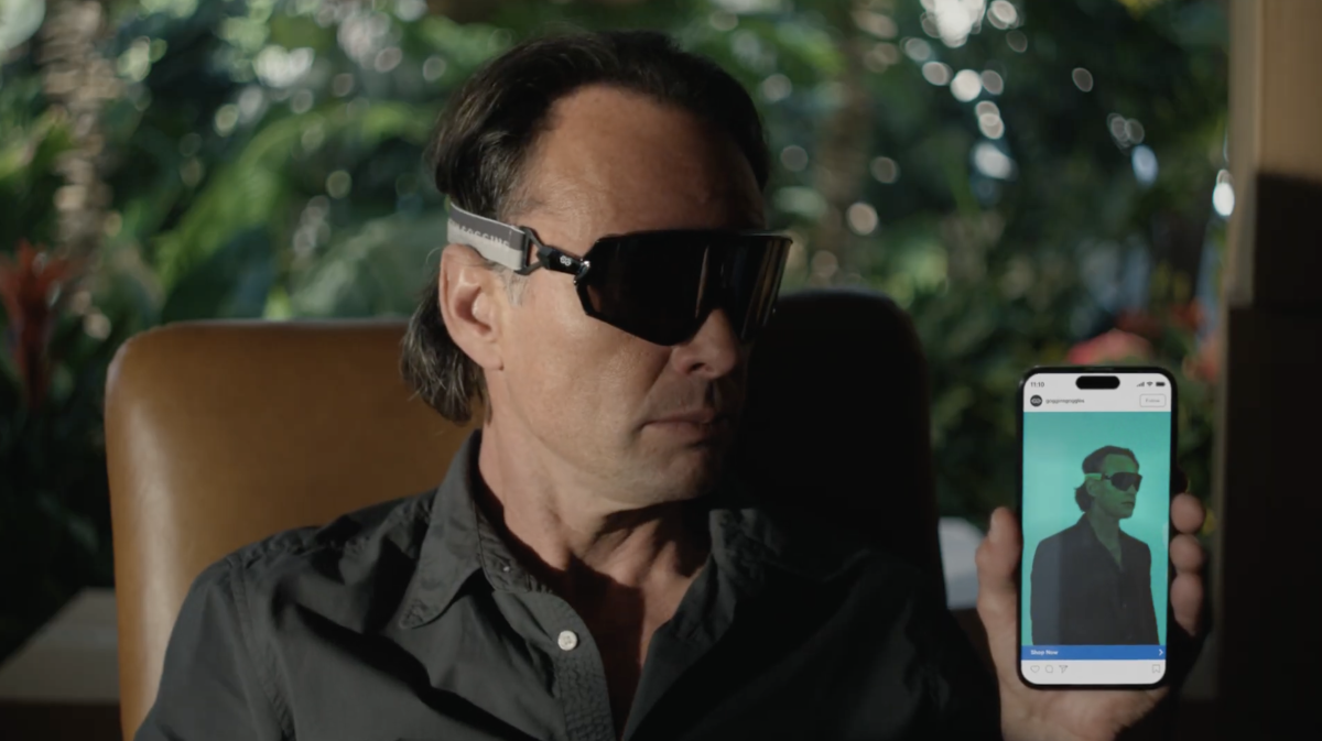 Walton Goggins holding smartphone with his picture on it