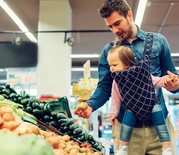 Parent holding child in grocery store