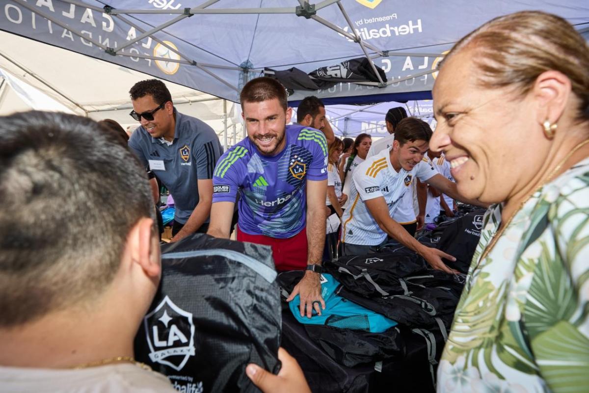 LA Galaxy players and staff helped distribute backpacks.