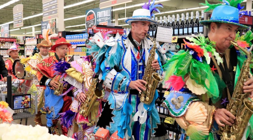 People dressed up for Italian-Heritage Month playing instruments