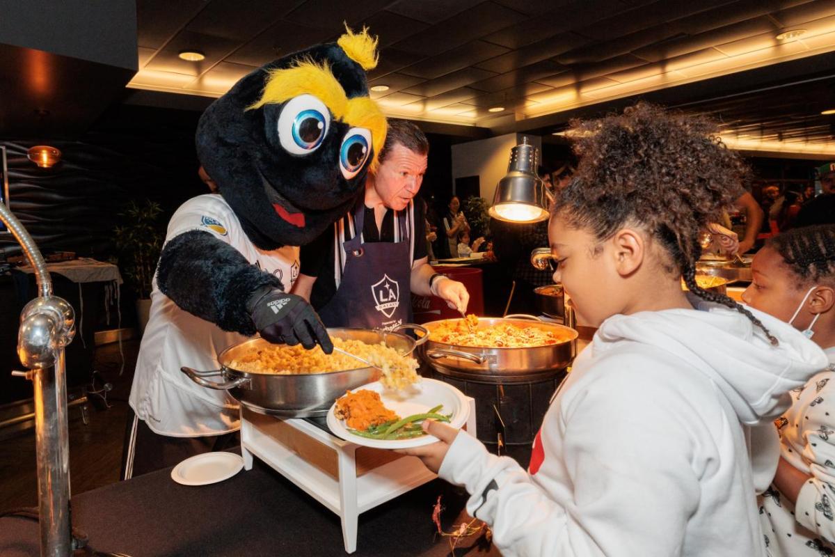 LA Galaxy mascot Cozmo helps serve meals to families in need at the the 20th annual Thanksgiving Foundations’ Feast at Dignity Health Sports Park in Carson, CA.