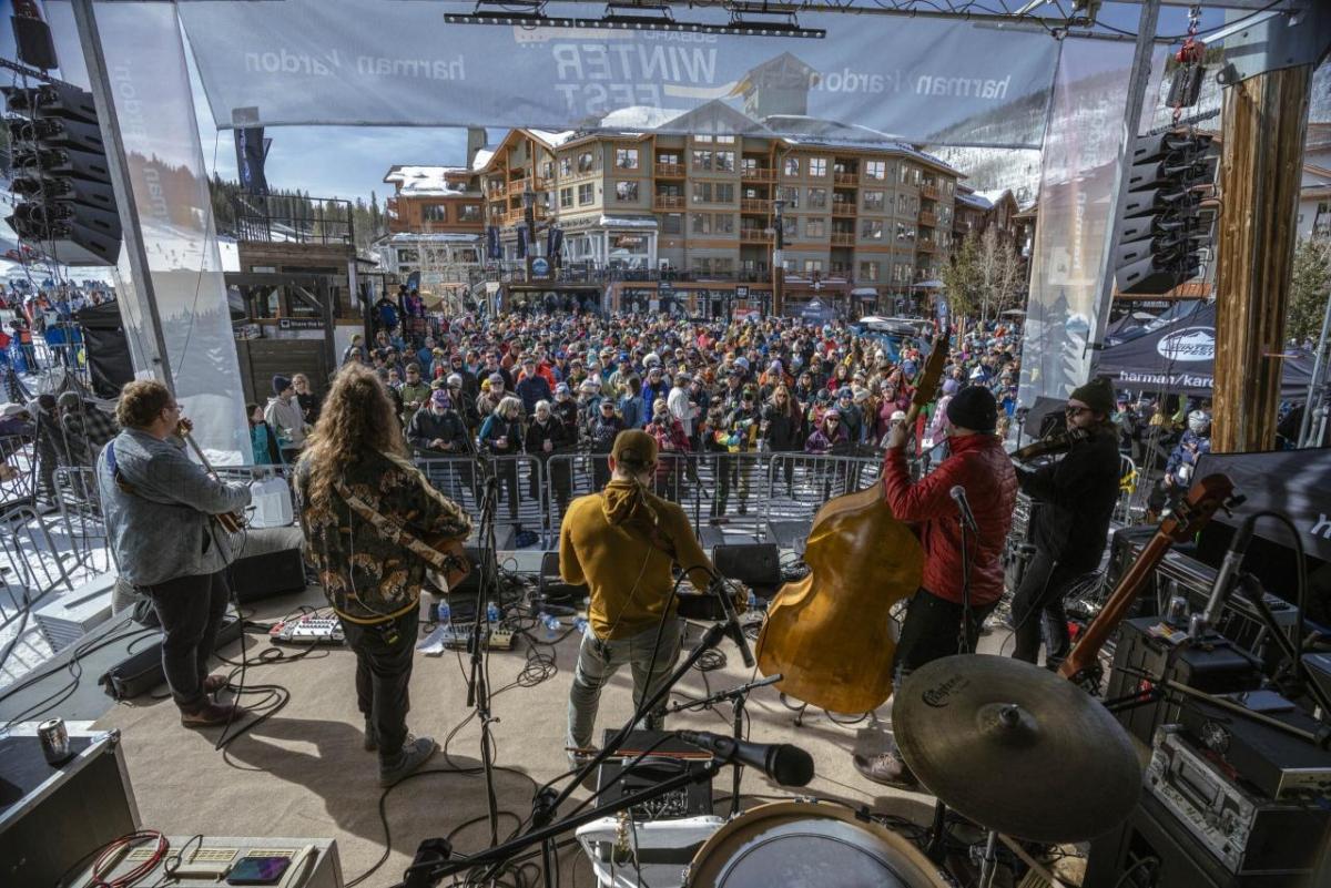 A band on a stage in front of a crowd