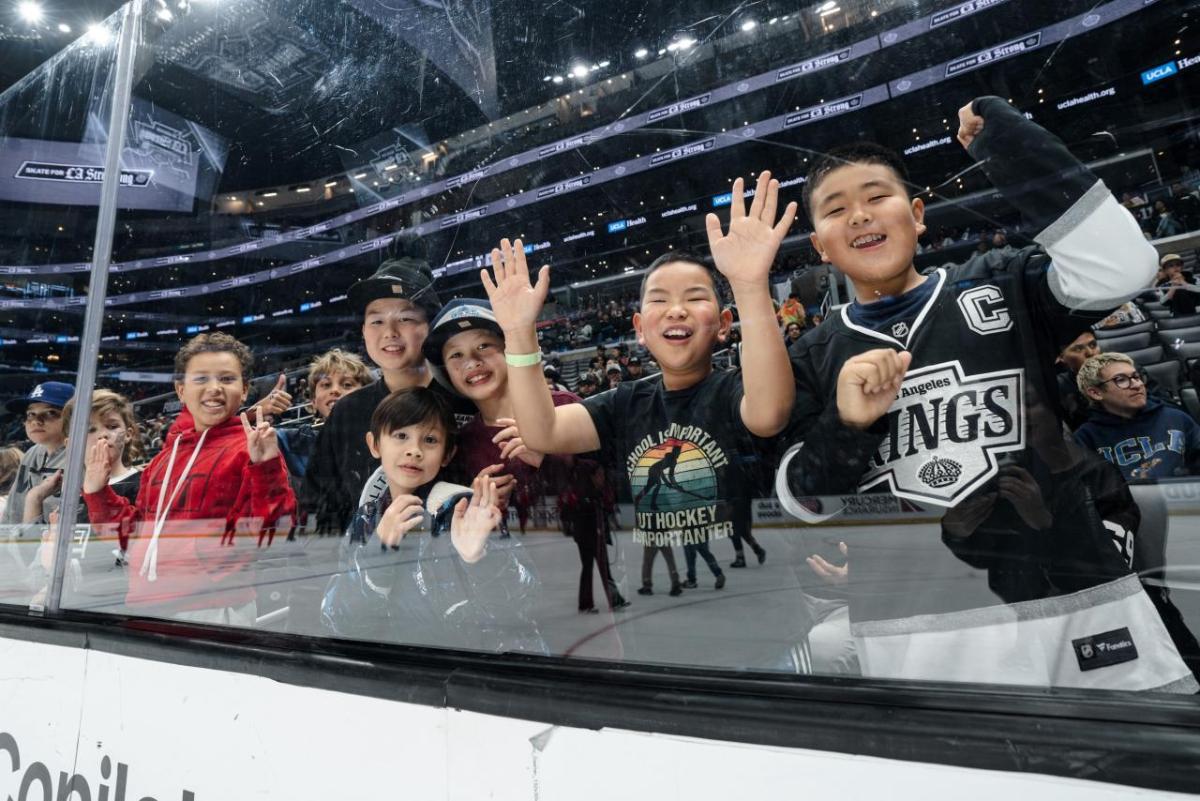 Attendees smiled as they enjoyed the game.