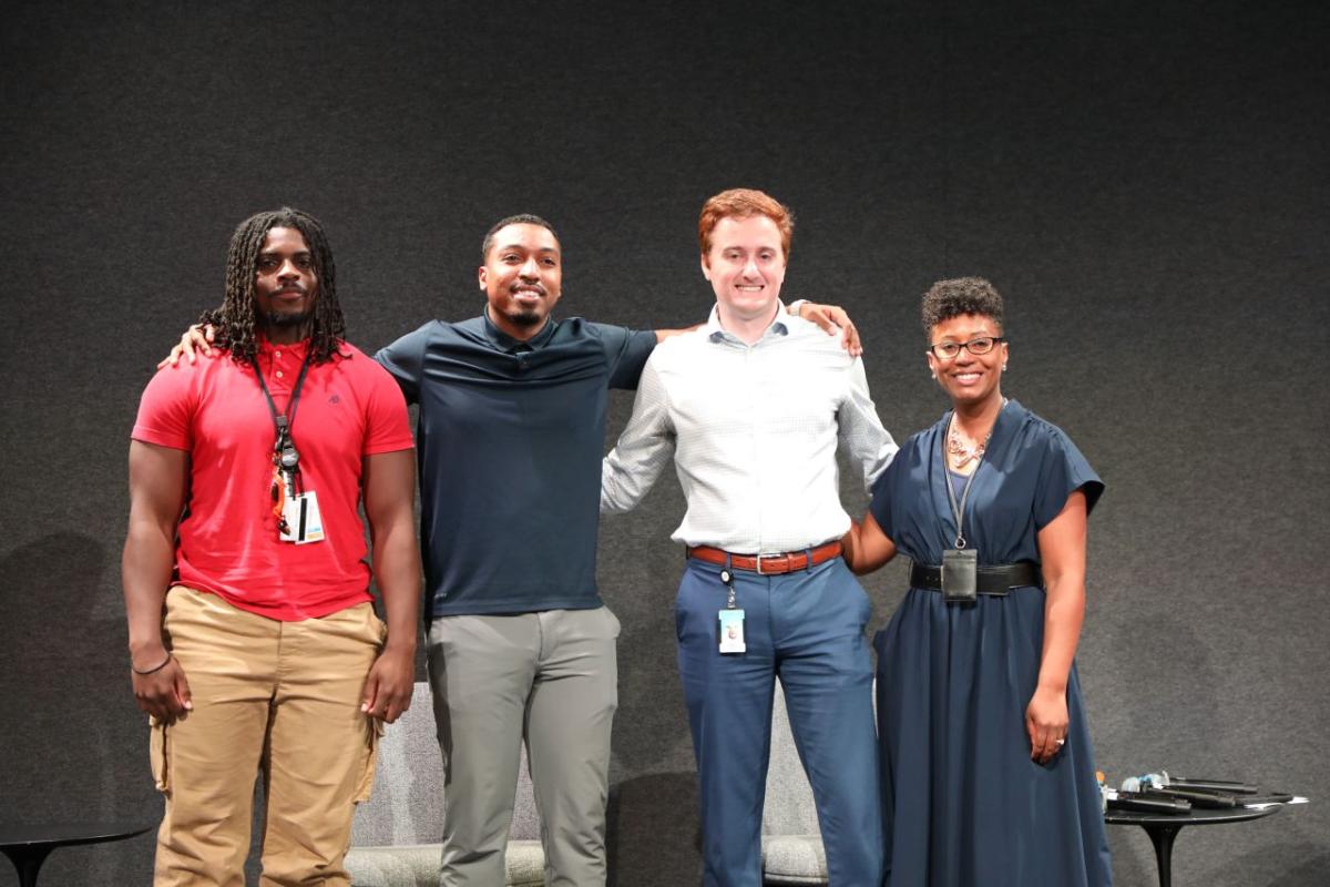 Four people stood together for a photo