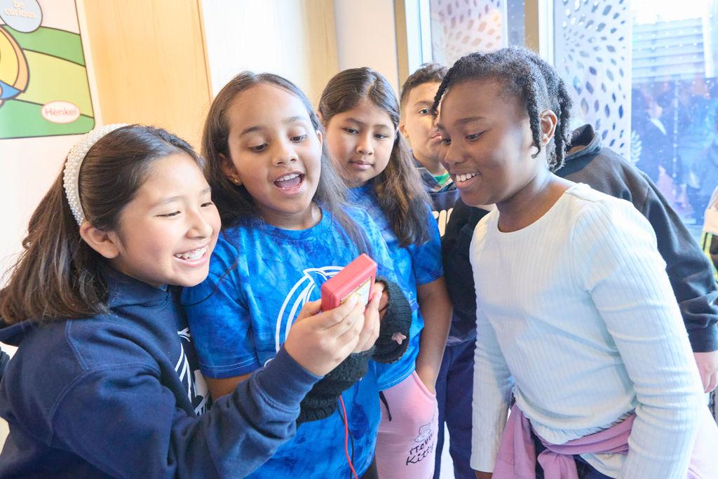 Students looking at a device