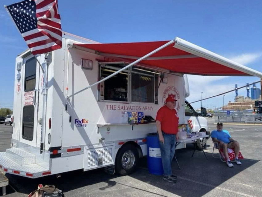 Two people outside a FedEx canteen truck