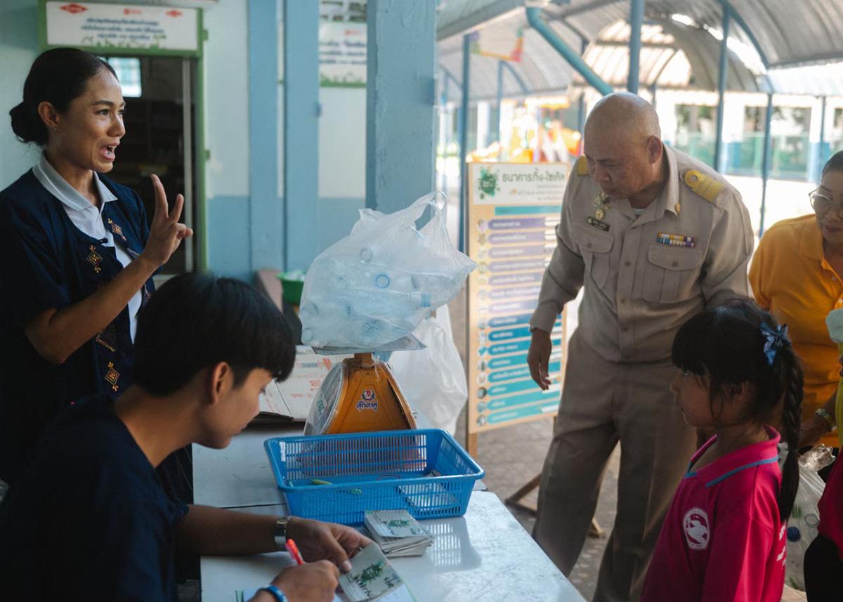 Two people serving customers 