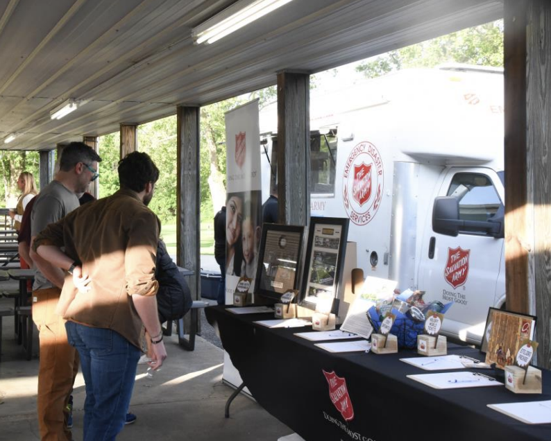 People looking at an event stand