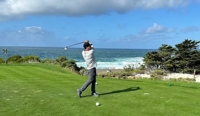 Alec Erceg playing golf.