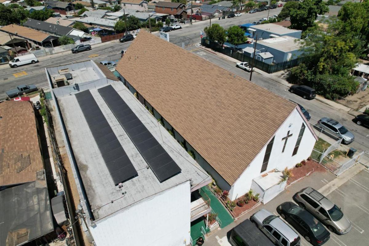 Church and side building with rooftop solar installation.