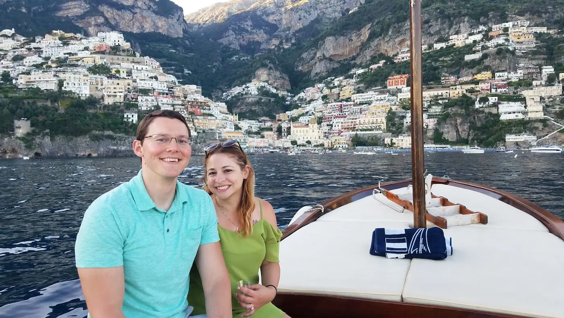 Calvin and his wife on a sailboat in Italy.