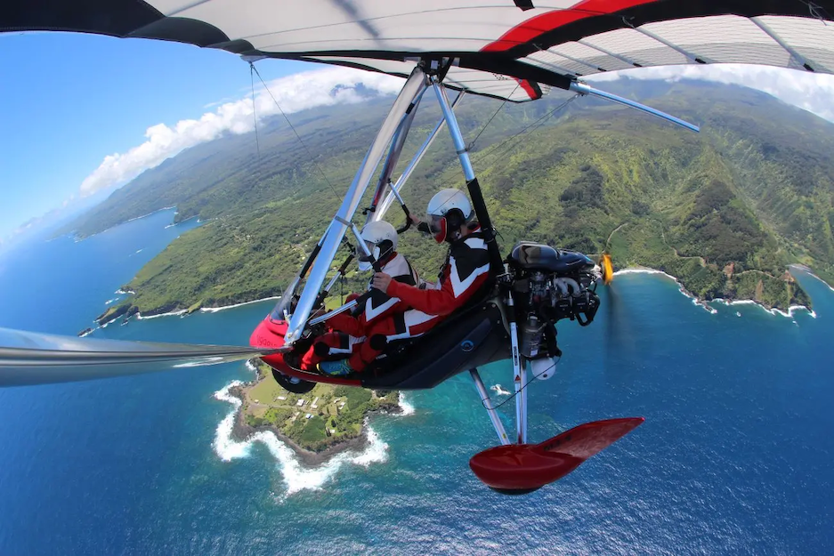 Calvin and his wife paragliding.