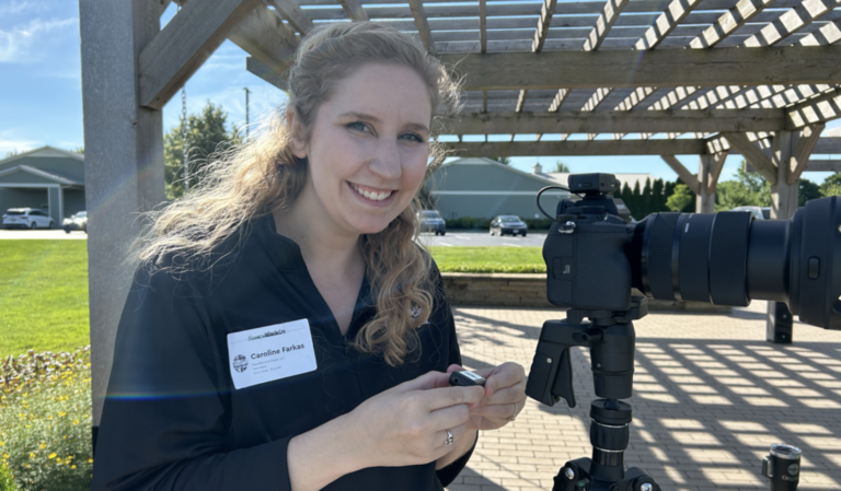 Caroline Farkas under a pergola outside